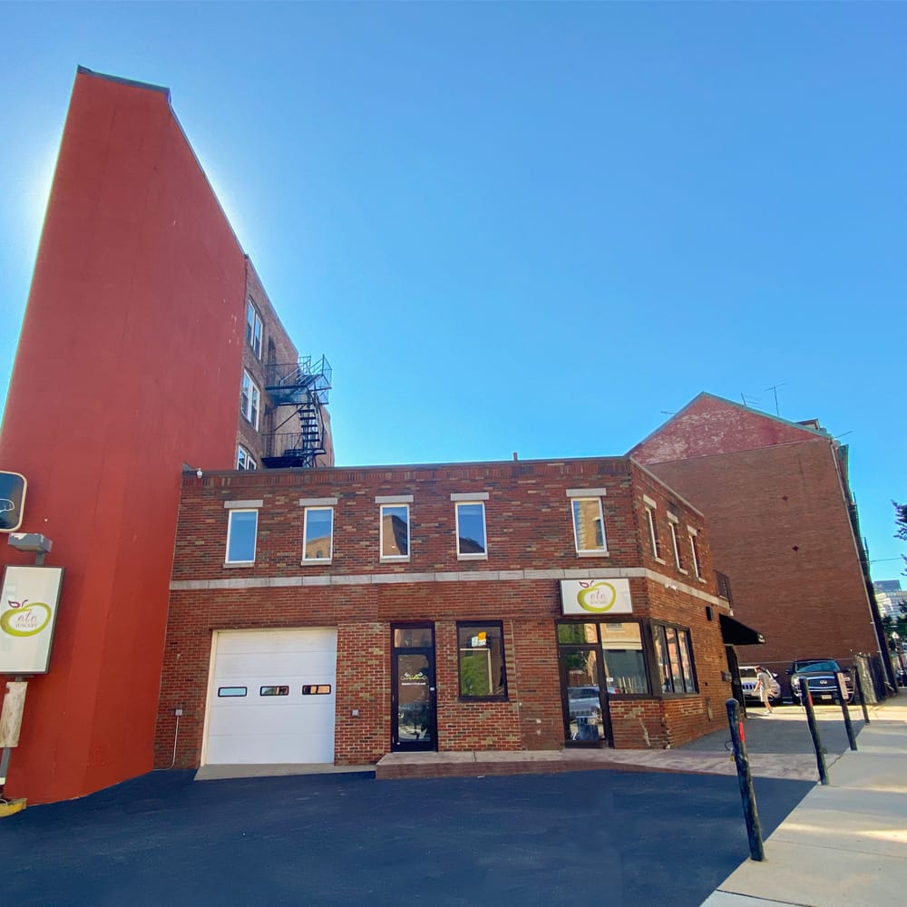 420 Commercial Street — DJ Realty Management office, attached to the 479 Hanover Street parking lot